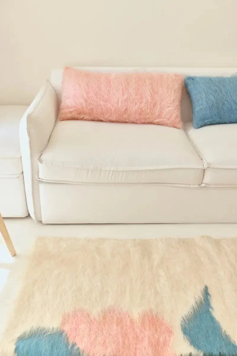 Pink handwoven wool pillow with brushed texture and natural Carpathian sheep wool on a cotton base
