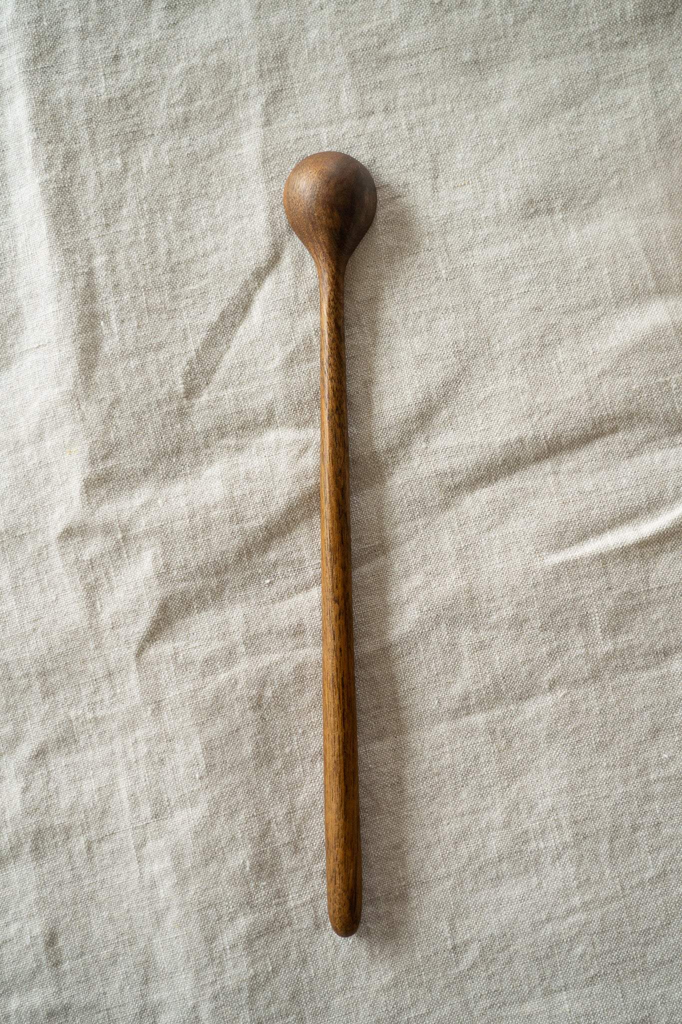 Hand carved walnut wood long coffee spoon with smooth finish and tall handle