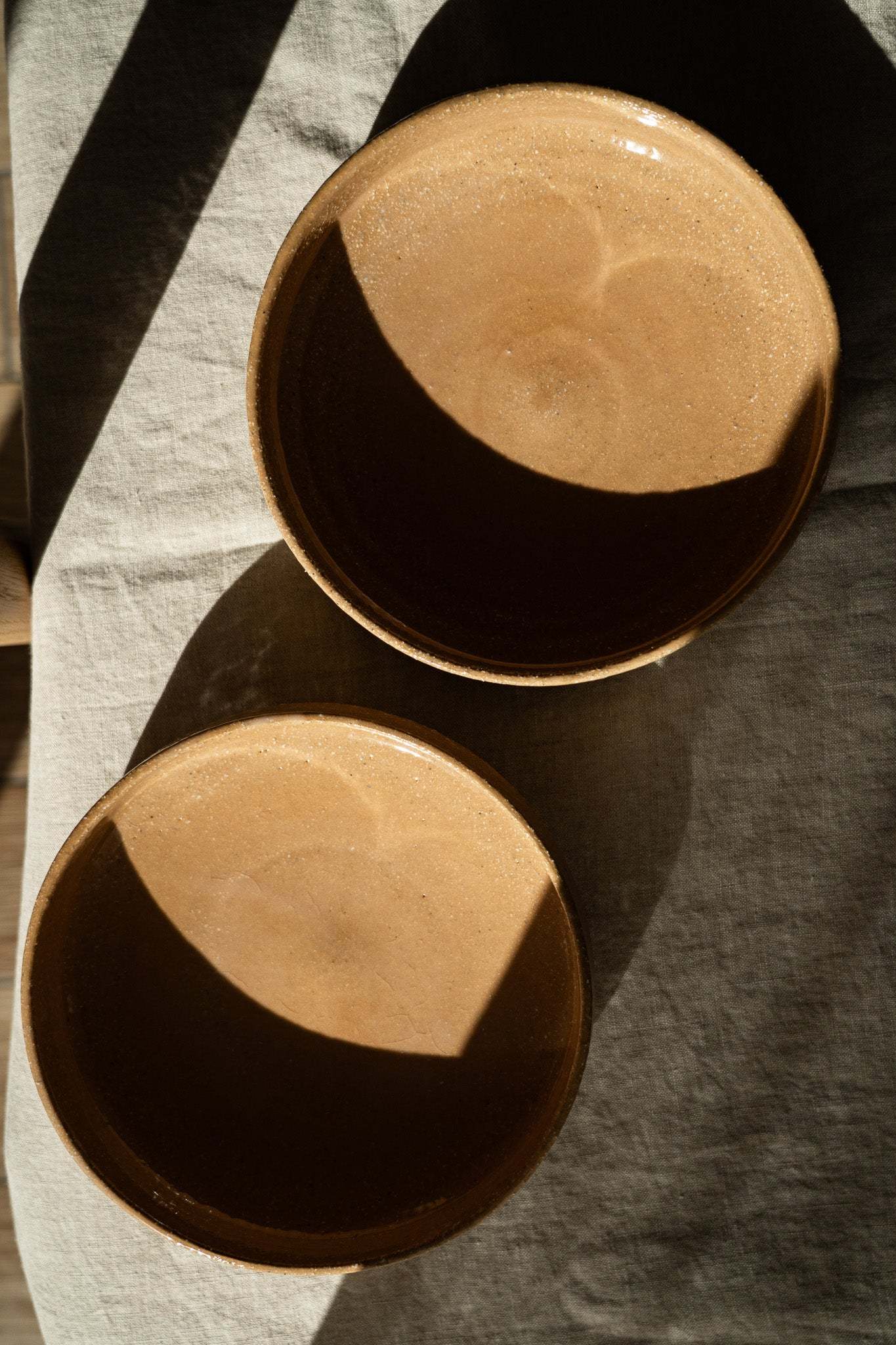 Handmade stoneware breakfast bowl in yellow clay with natural speckles and glazed interior