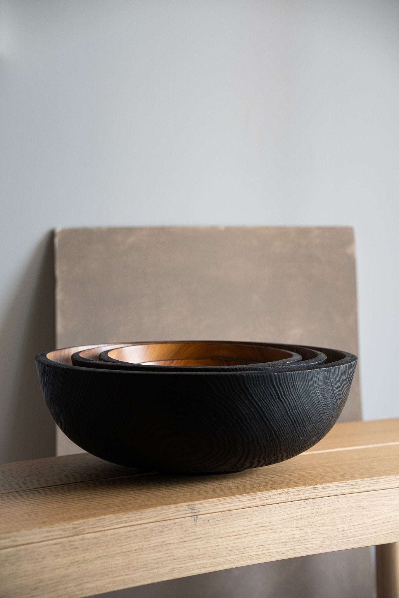 Hand carved extra large wooden bowl with half charred interior and exterior finish made from solid ash wood