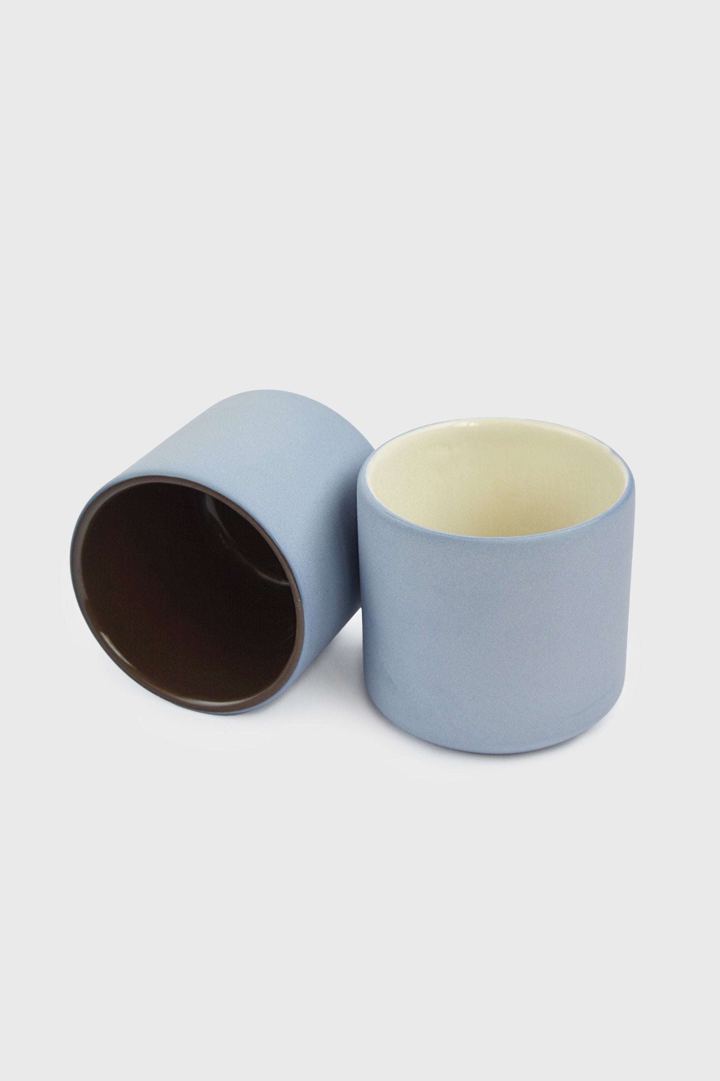 Handmade porcelain coffee cup with forget-me-not exterior and chocolate interior glaze, dishwasher safe