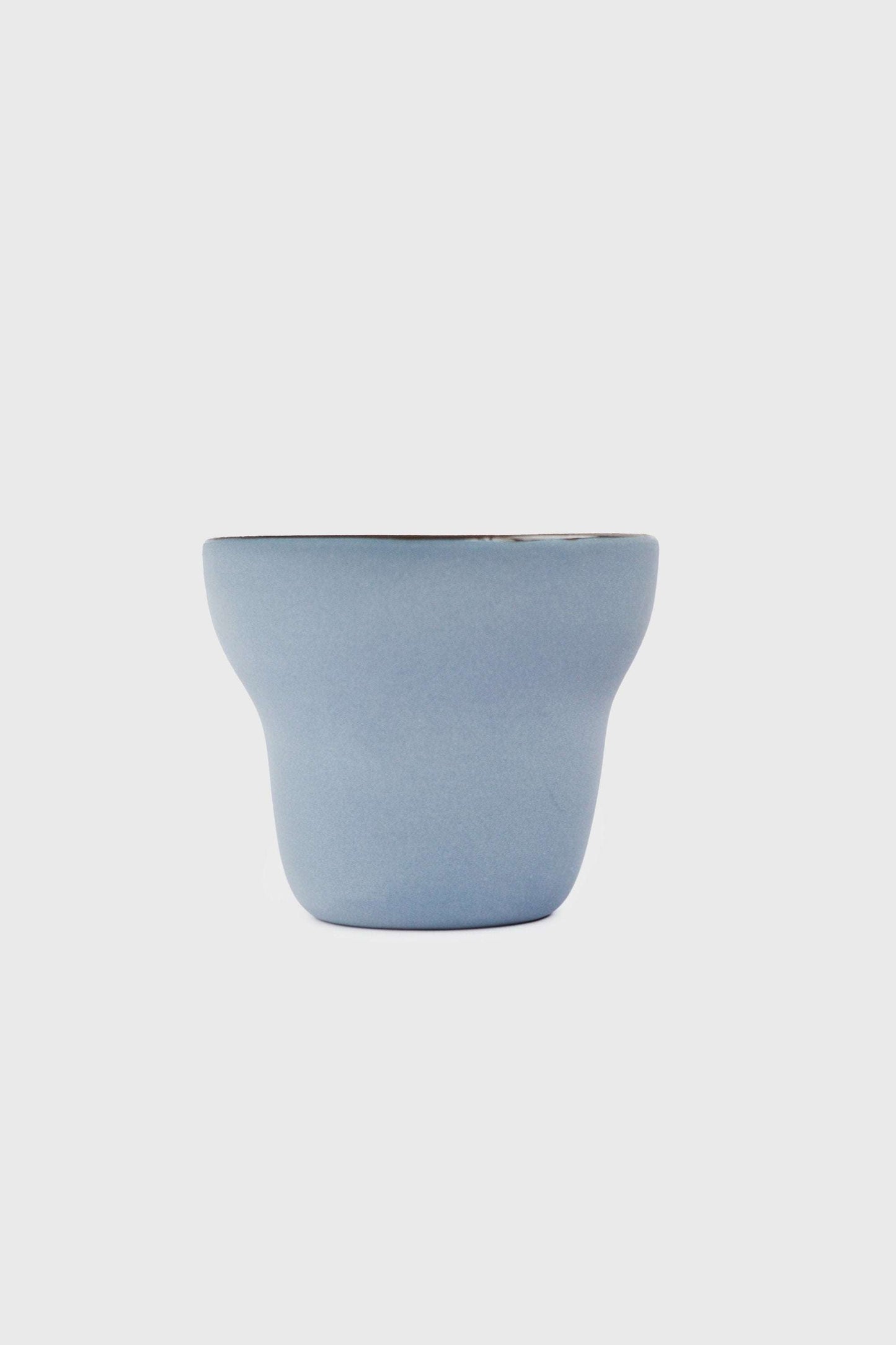 Handmade pear-shaped porcelain coffee cup with forget-me-not exterior and chocolate interior glaze