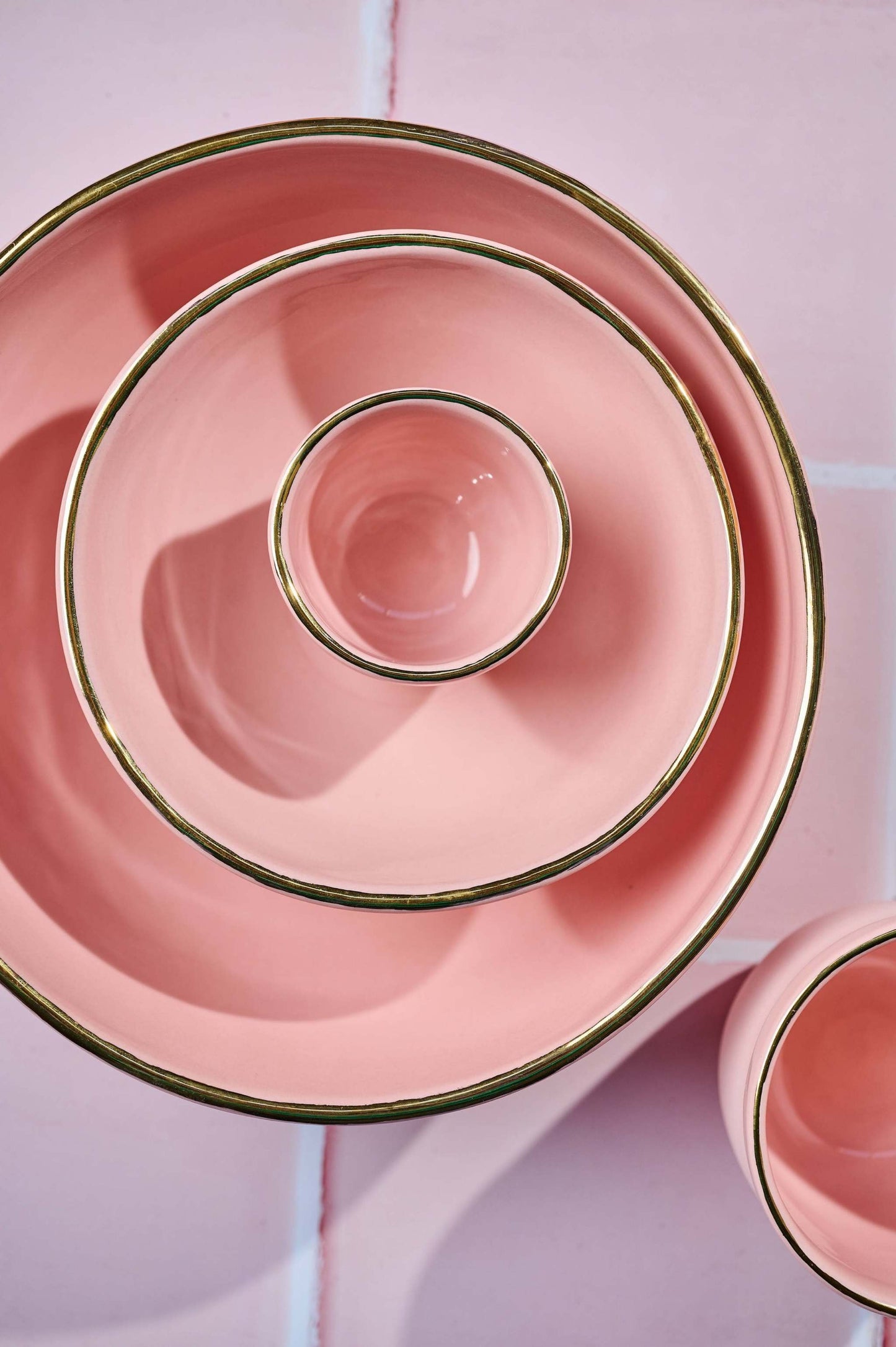 Handmade porcelain espresso cup in powder pink with gold rim and smooth glaze