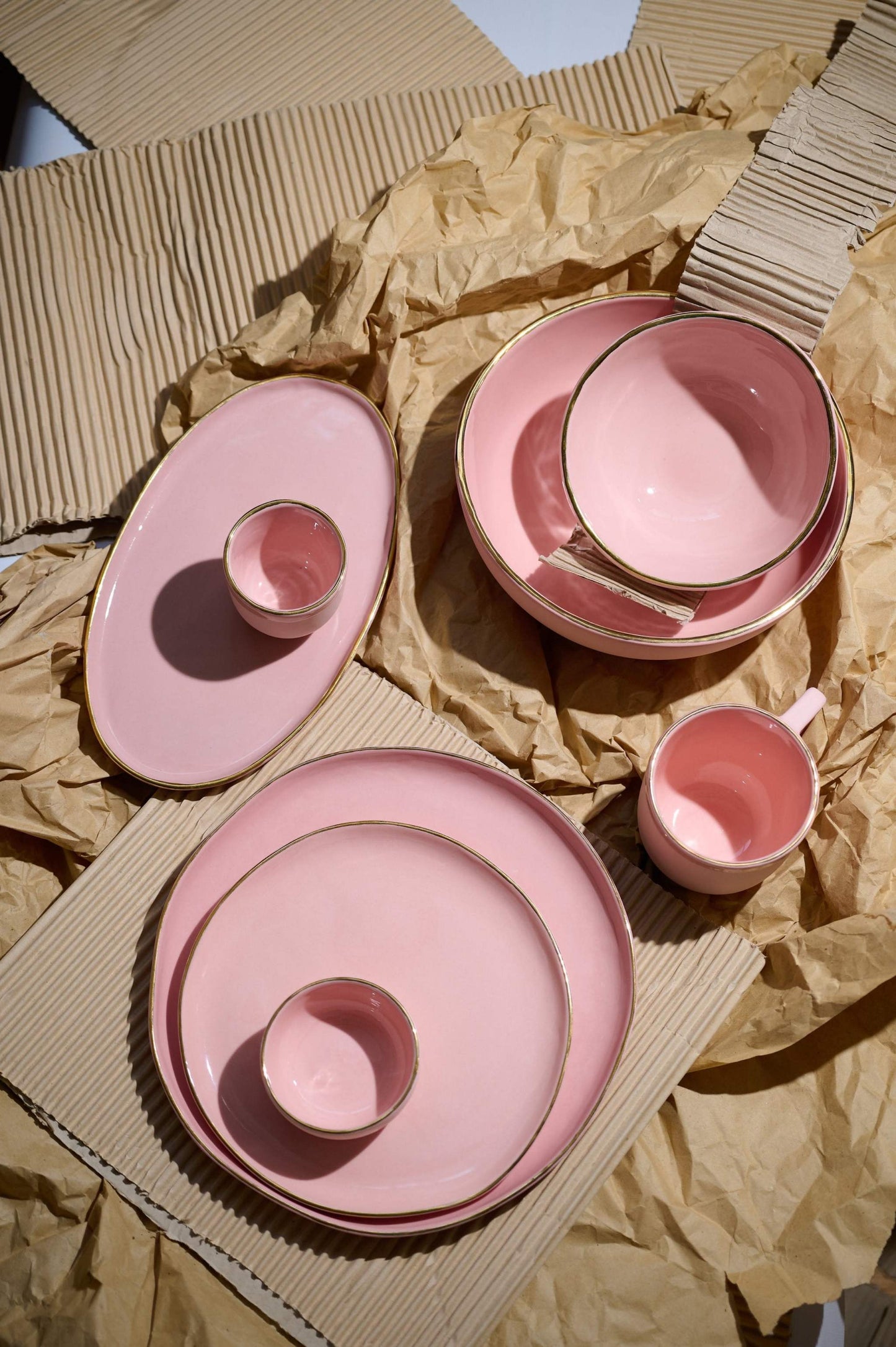 Handmade porcelain bowl powder pink with gold rim and shiny glaze