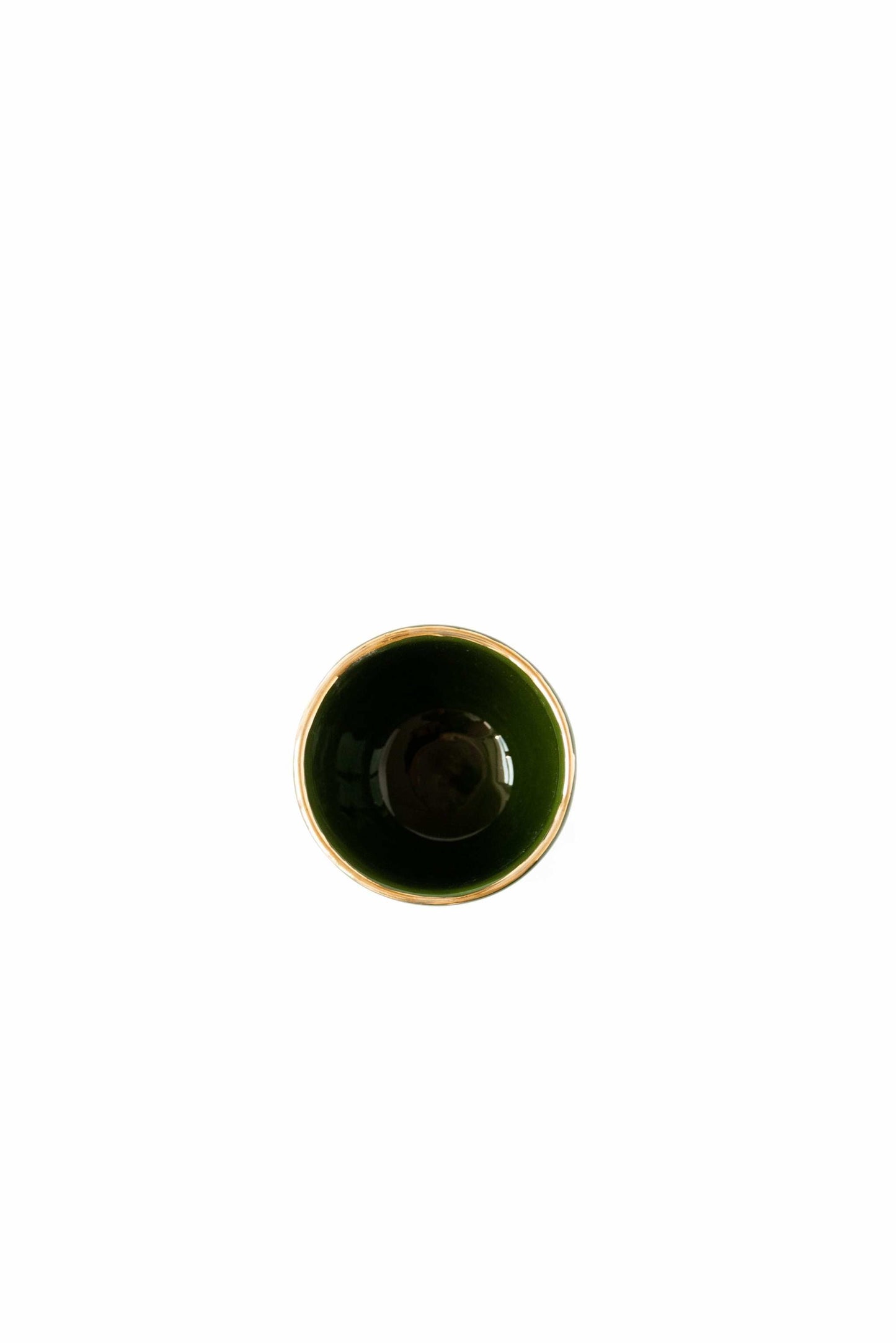 Handmade porcelain espresso cup in green with gold rim and exposed clay exterior