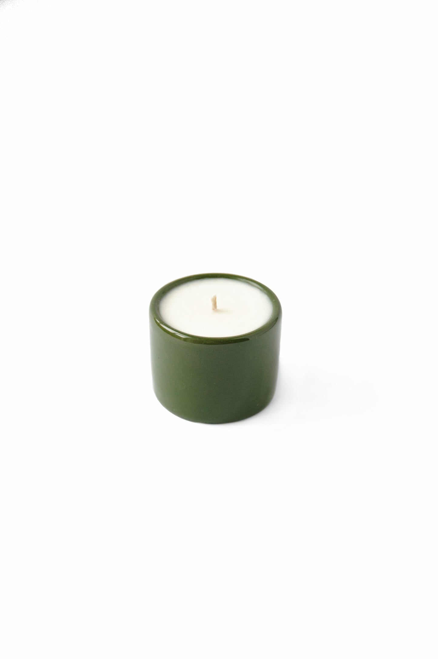 Handmade green porcelain candle with organic soy wax in a refillable bowl, made in Ukraine