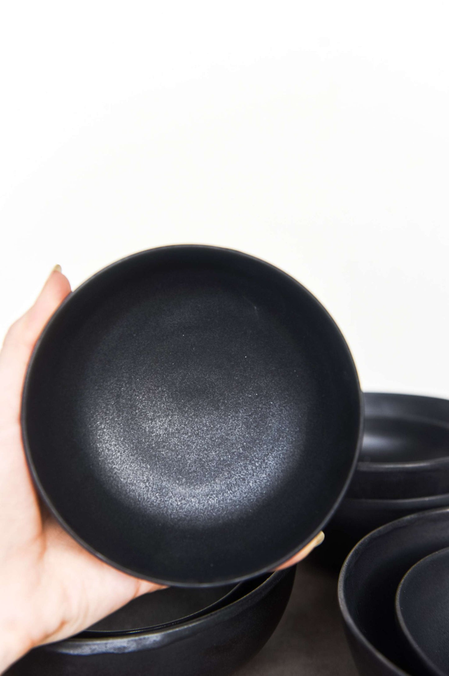 Handmade black mini stoneware bowl with matte finish and organic curves, dishwasher and microwave safe