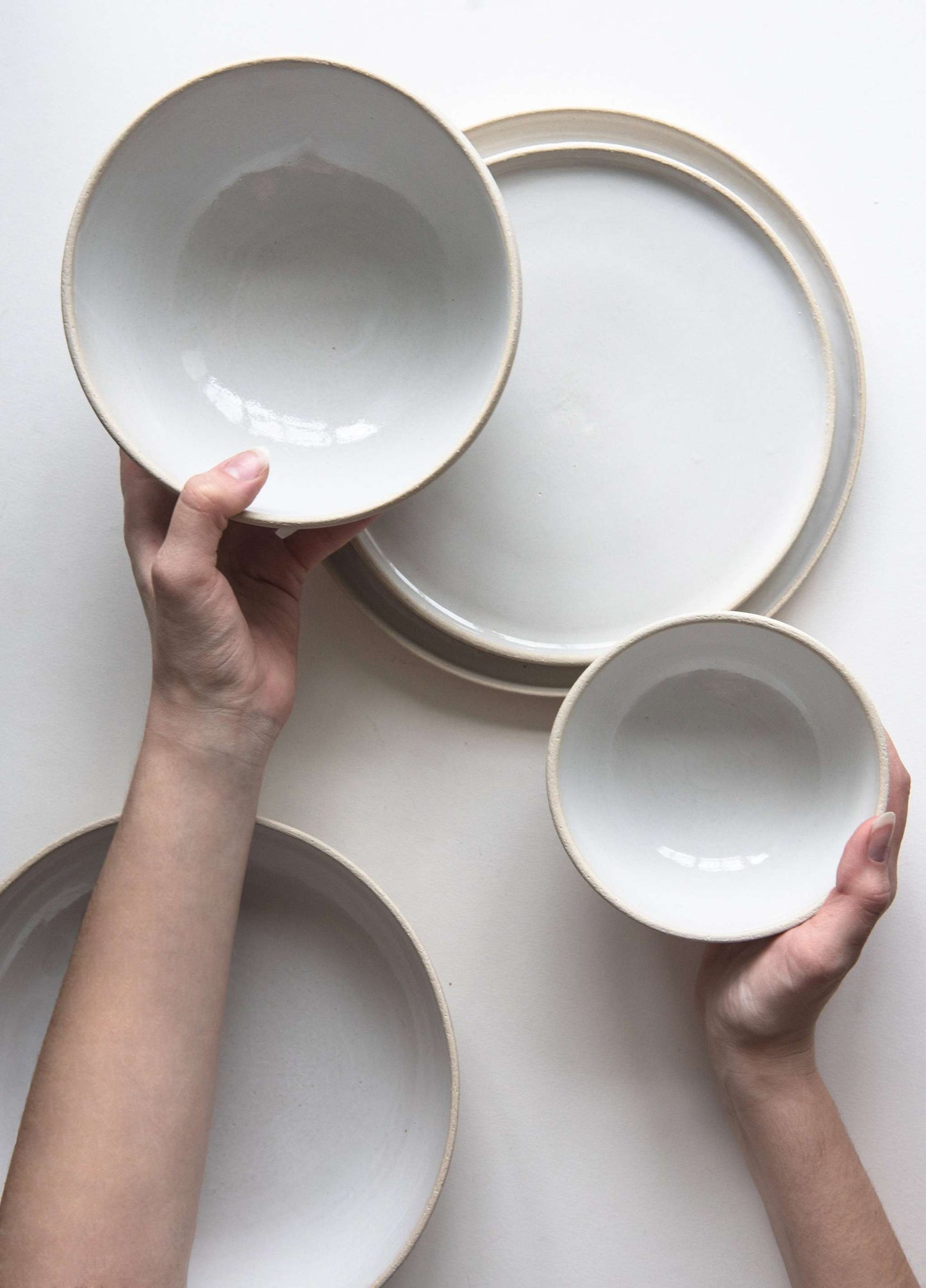 Handmade stoneware small bowl with textured exterior and smooth white glaze, microwave and dishwasher safe