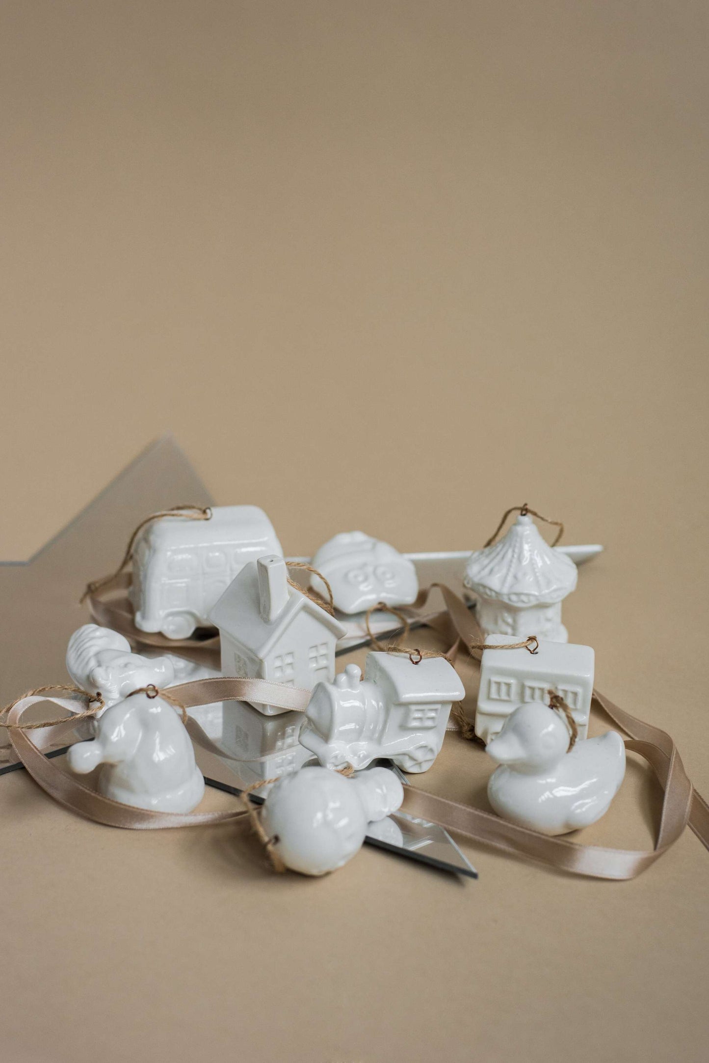 Handmade white porcelain Christmas ornaments with jute loops, rustic holiday decor made in Ukraine