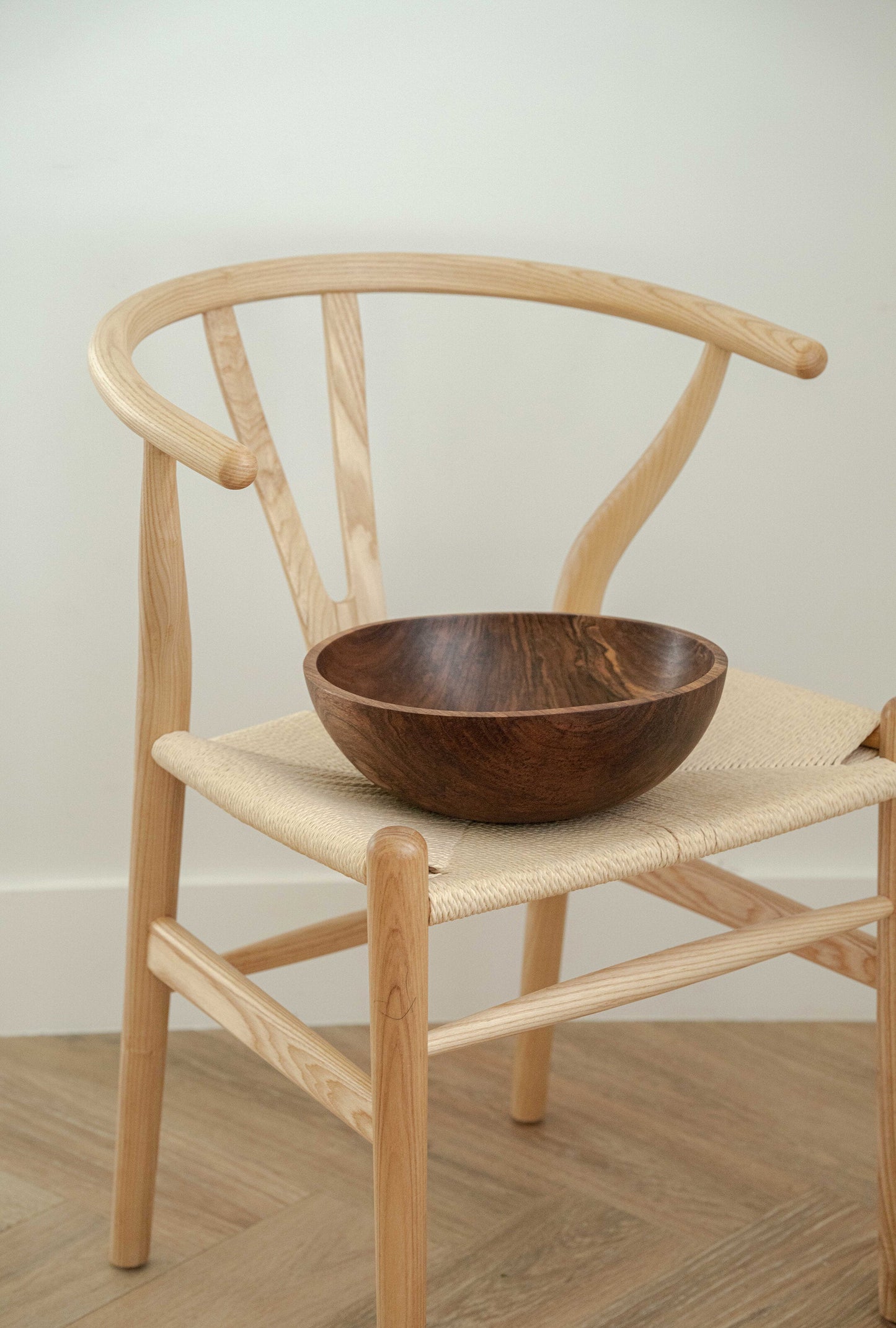 Hand-carved large walnut wood bowl with natural dark color and smooth finish, made in Ukraine.