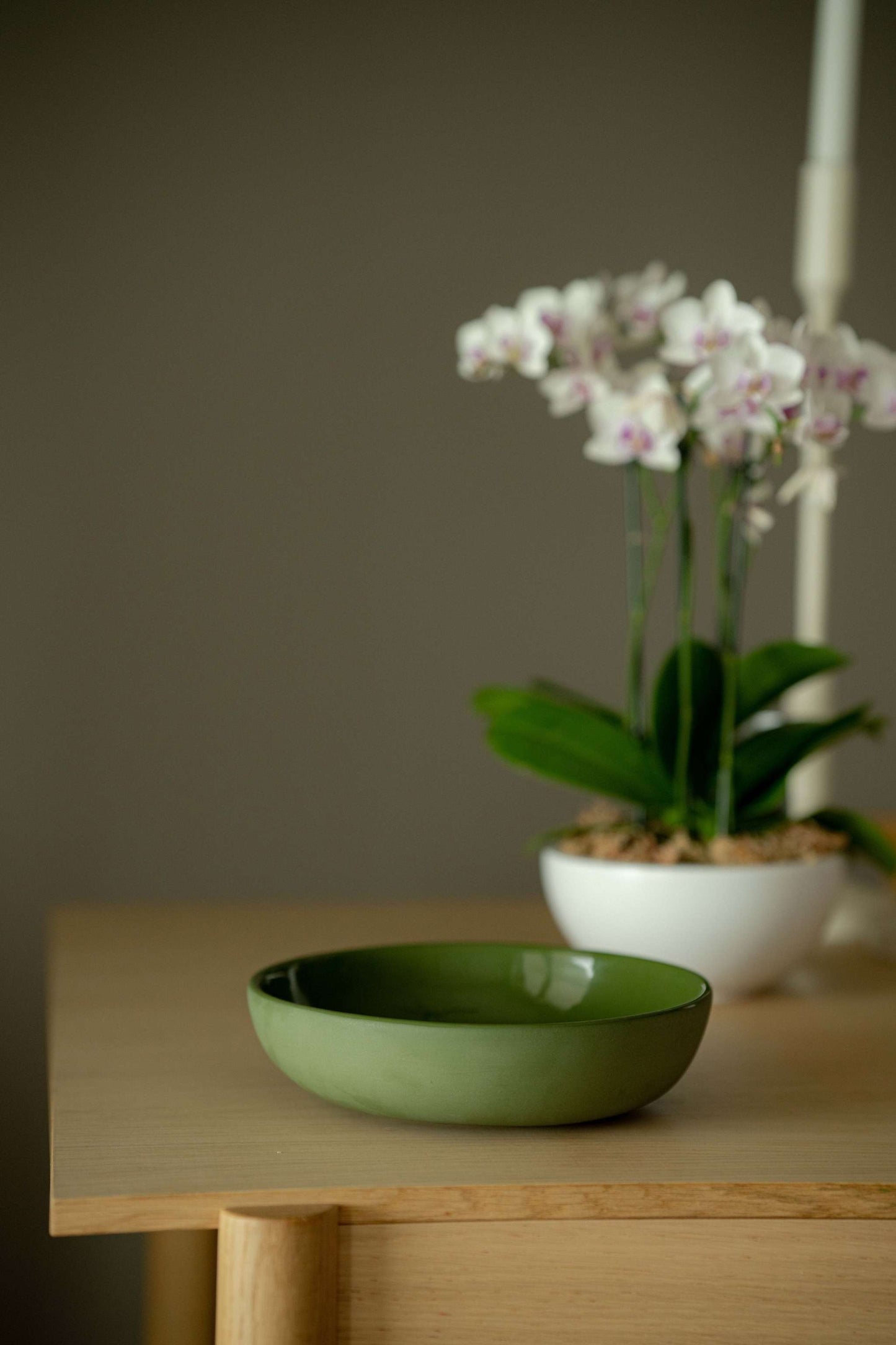 Handmade green porcelain pasta bowl with glossy glaze and high sides for pasta and salad