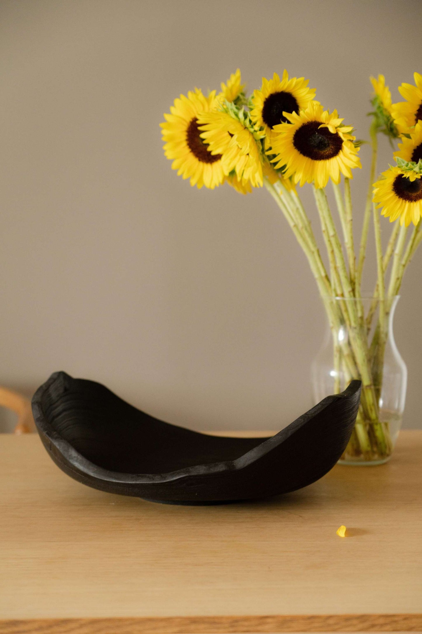 Hand-carved large charred wood shallow bowl with ripped edges, made from solid ash wood, finished with food-safe oil, unique handmade piece from Ukraine