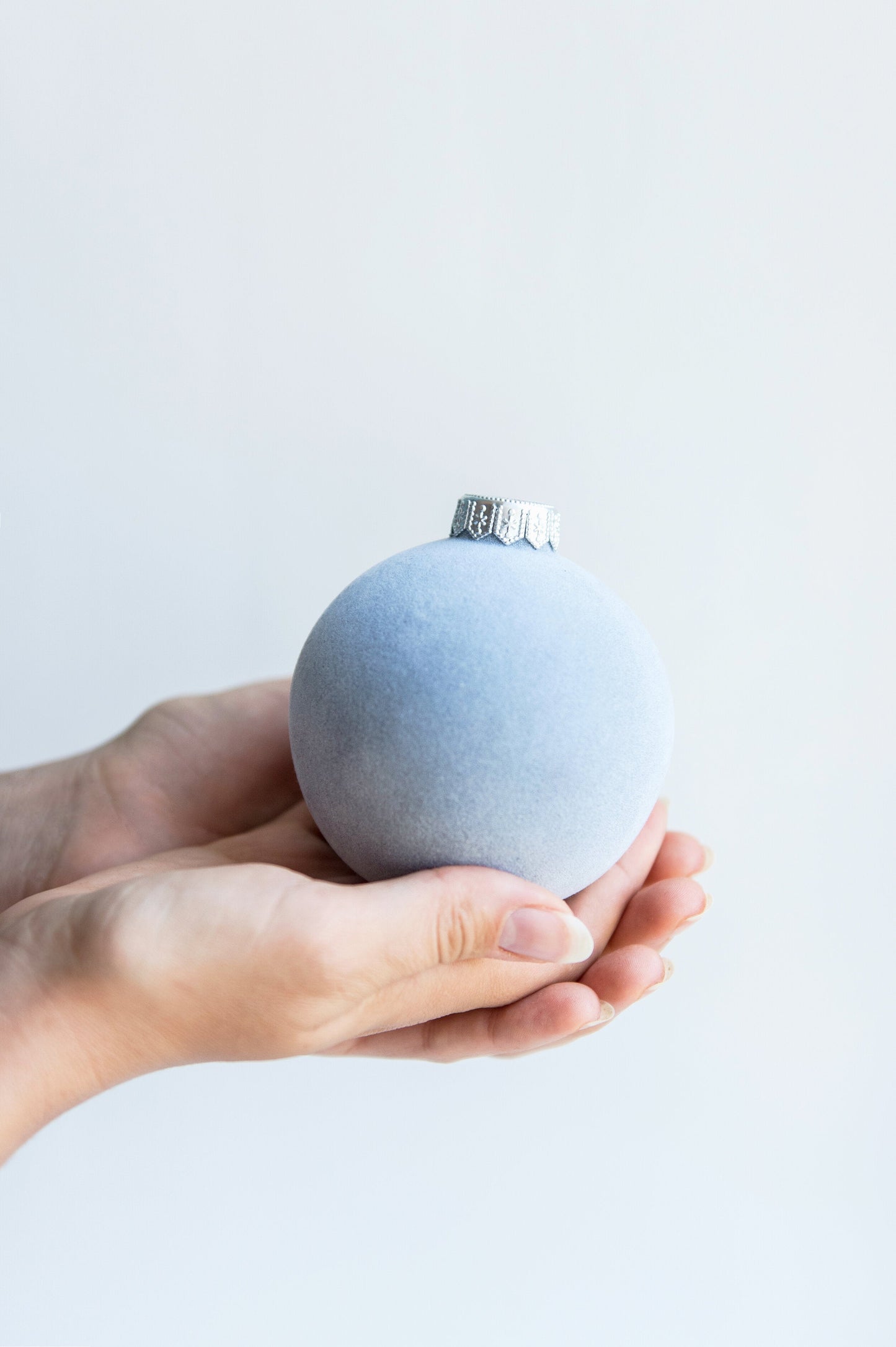 Porcelain velour Christmas ball ornament with silver cap and shiny ribbon, handmade in Ukraine