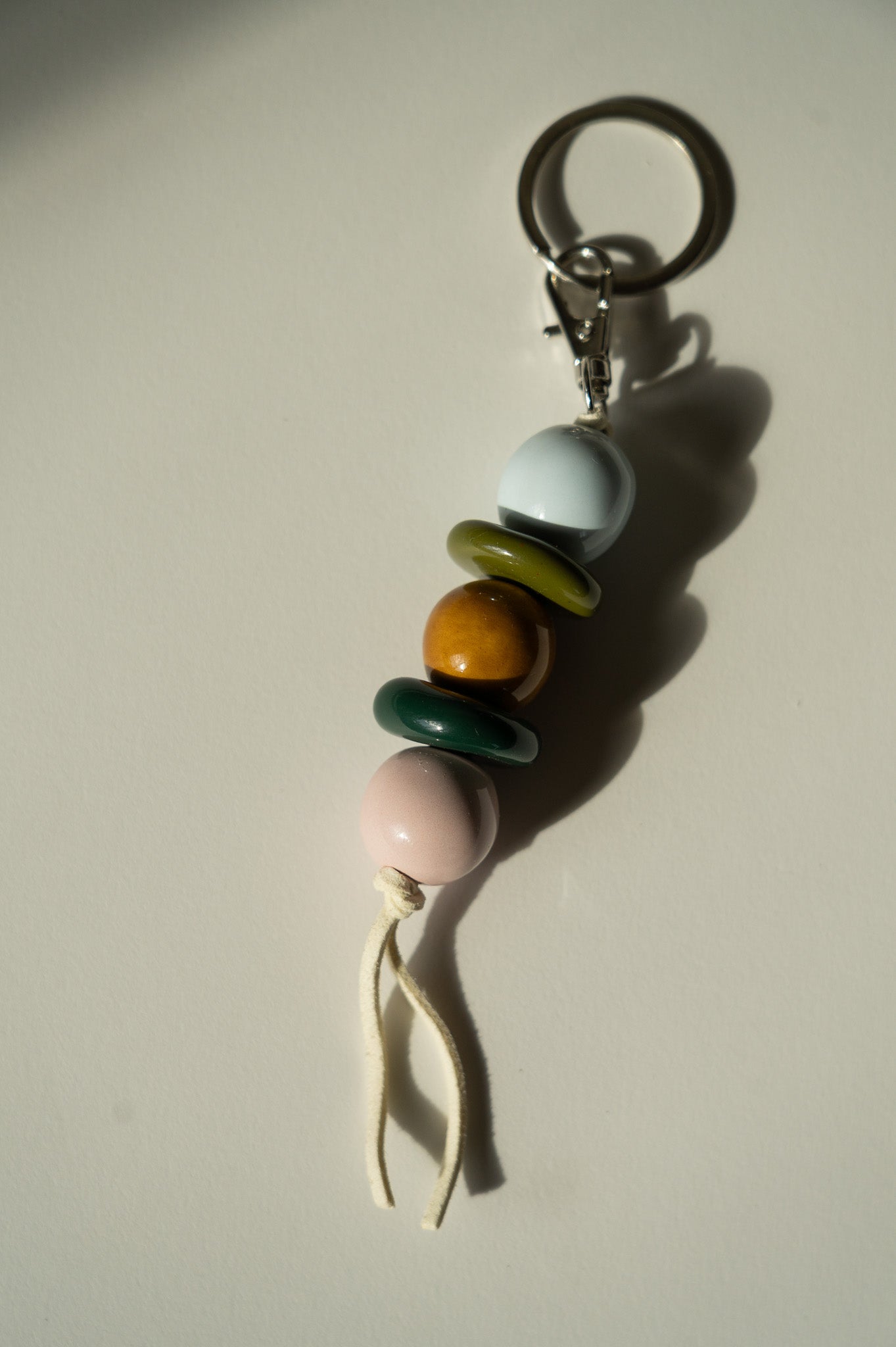 Handmade Ceramic Beaded Keychain in Brown and Green Tones