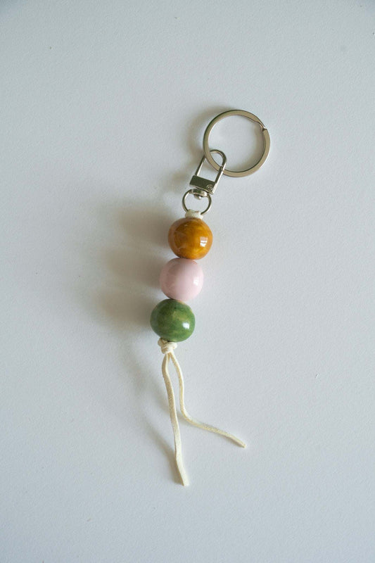 Handmade Ceramic Keychain in Warm Contrast Tones
